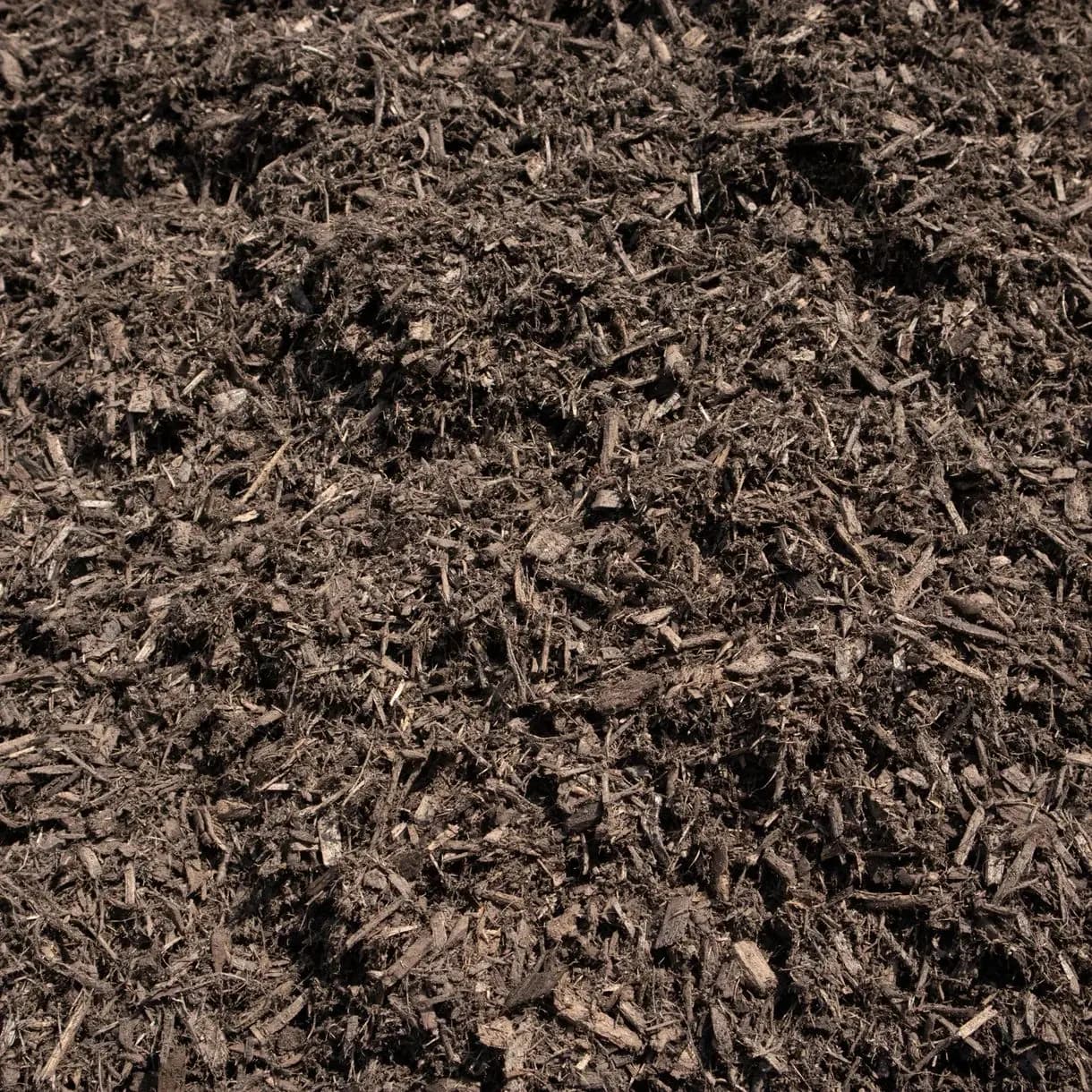 A pile of brown wood mulch.